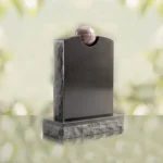 Lápida conmemorativa moderna con detalle esférico